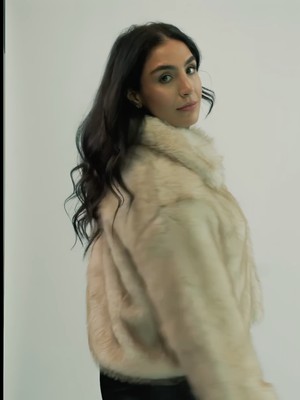 Amaya Lala in a cream fur coat, an editorial frame from the Kurt Muller womenswear campaign